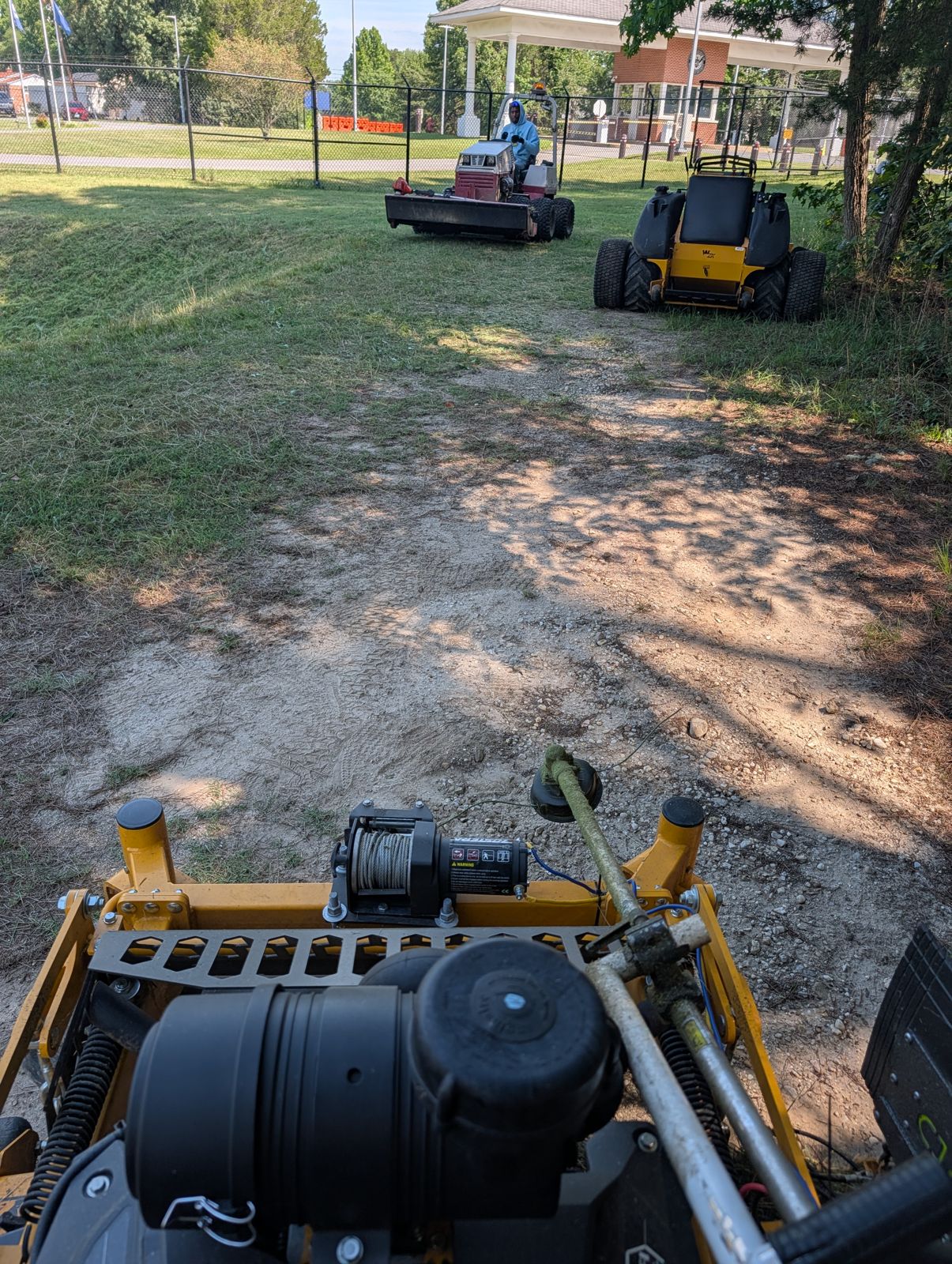 Crew mowing a commercial property