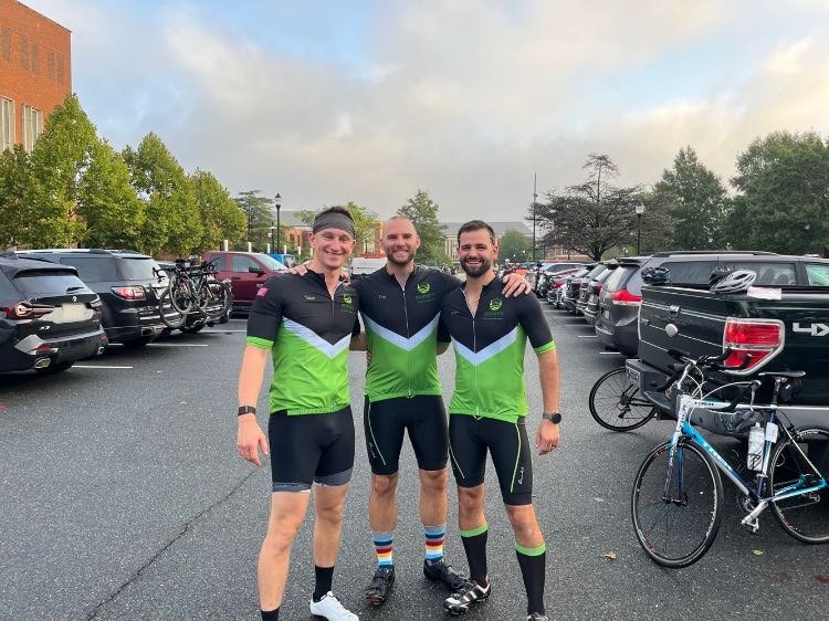 Three riders in Redman Structures cycling kits before a 100-mile ride